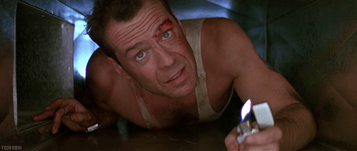Bruce Willis in air duct with lighter