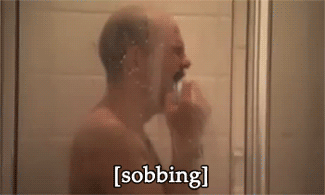 Man sobbing in the shower