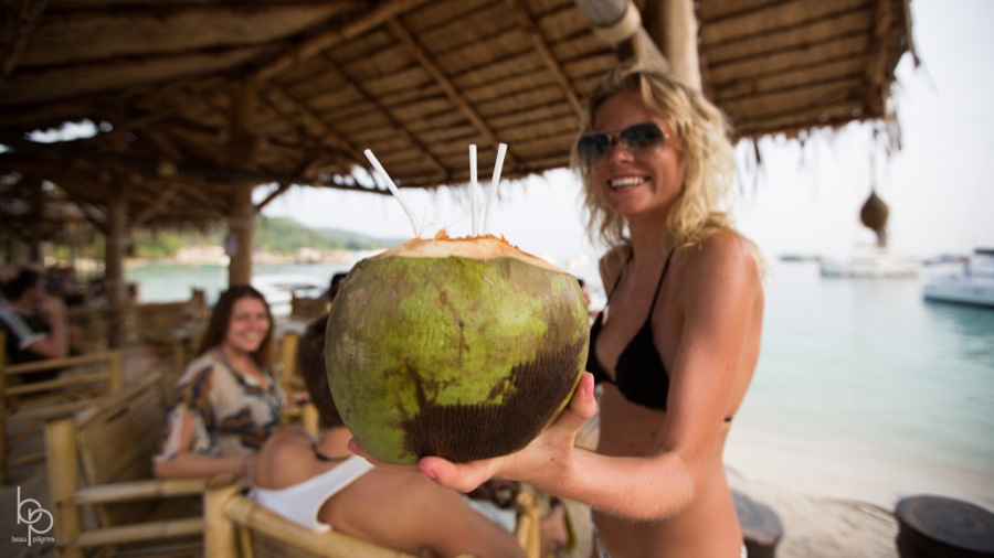 Person with a coconut drink