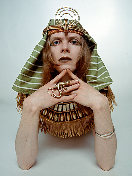 Bowie posing in costume