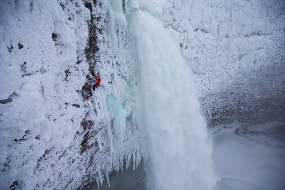 Will Gadd climbing the first ascent on a mixed route, Overhead Hazard at Helmcken Falls in Wells Gray Provincial Park, BC, Canada. 