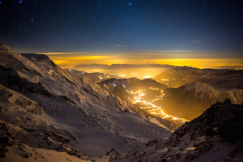 The sun has set, the stars have risen and the town of Chamonix, France lights up the beautiful Mont Blanc Massif.  