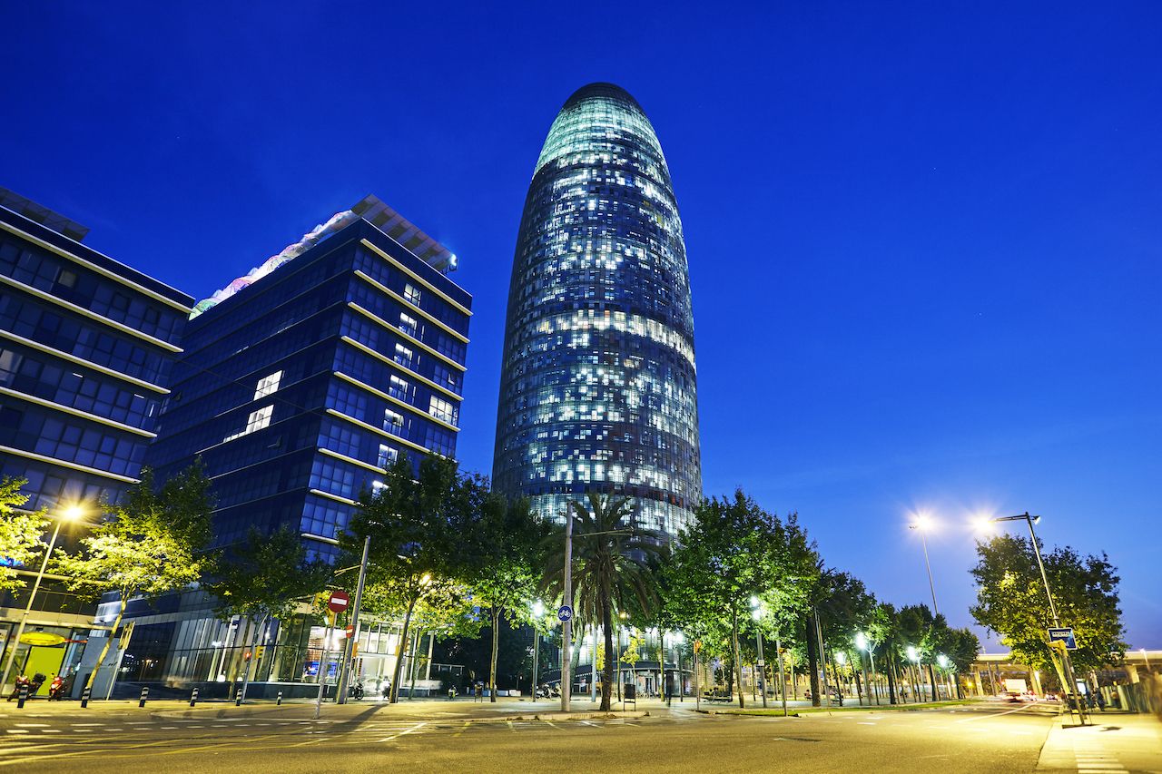 Low angle view of the Torre Agbar tower illuminated at night in Barcelona