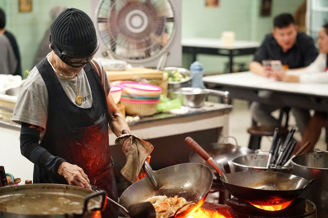 Michellin-starred chef Jay Fai cooking 