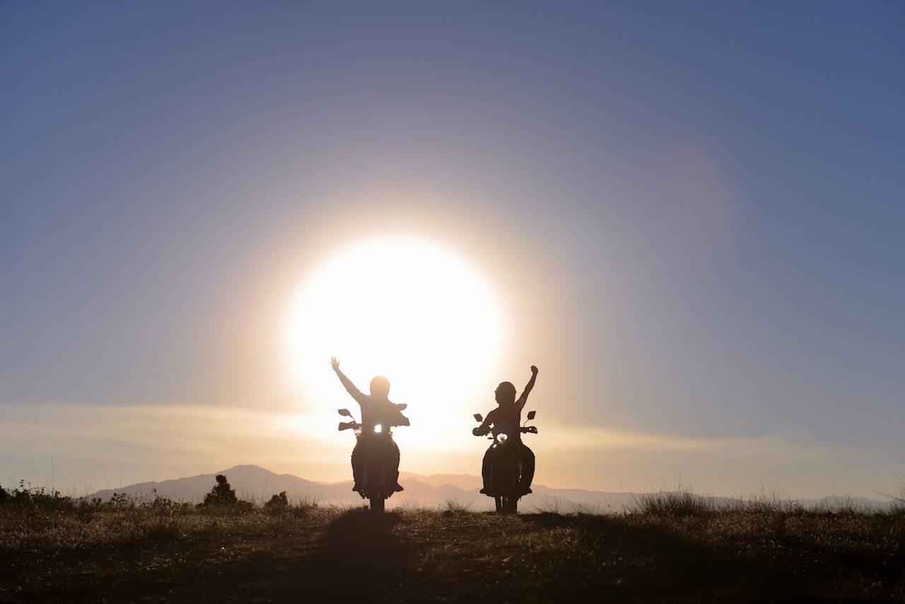 Couple riding motorbikes