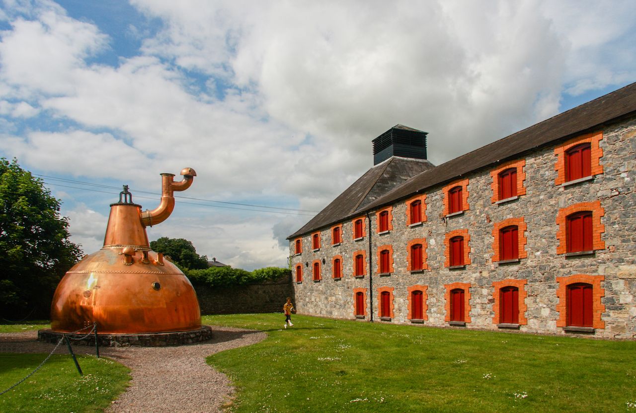 Old big copper whiskey distillery on stone foundation at the Jameson Heritage Center in Midleton Co. Cork
