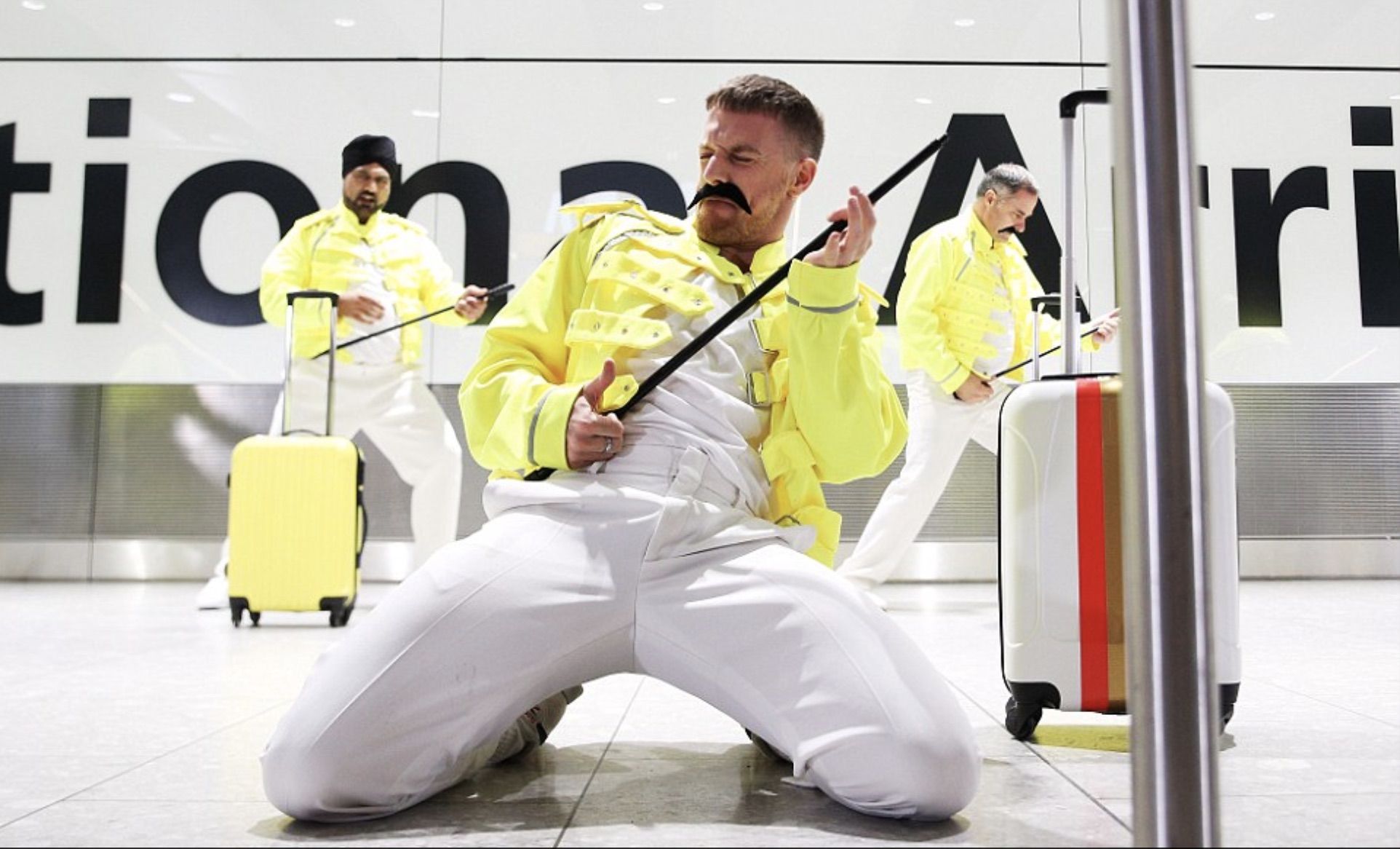 Baggage handlers at Heathrow in London celebrating Freddie Mercury