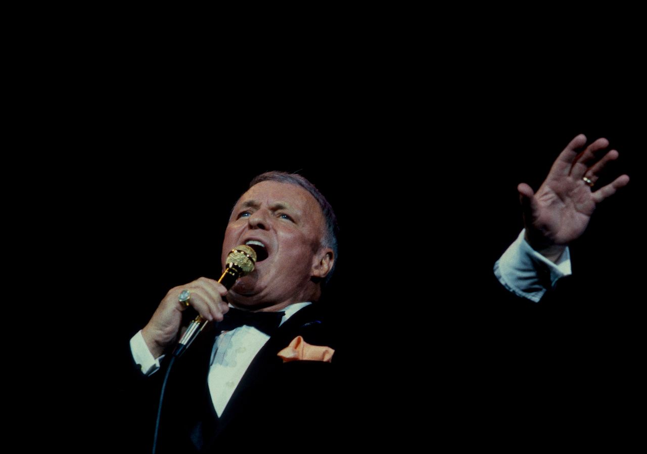 Frank Sinatra performs at the reopening of the Chicago Theater