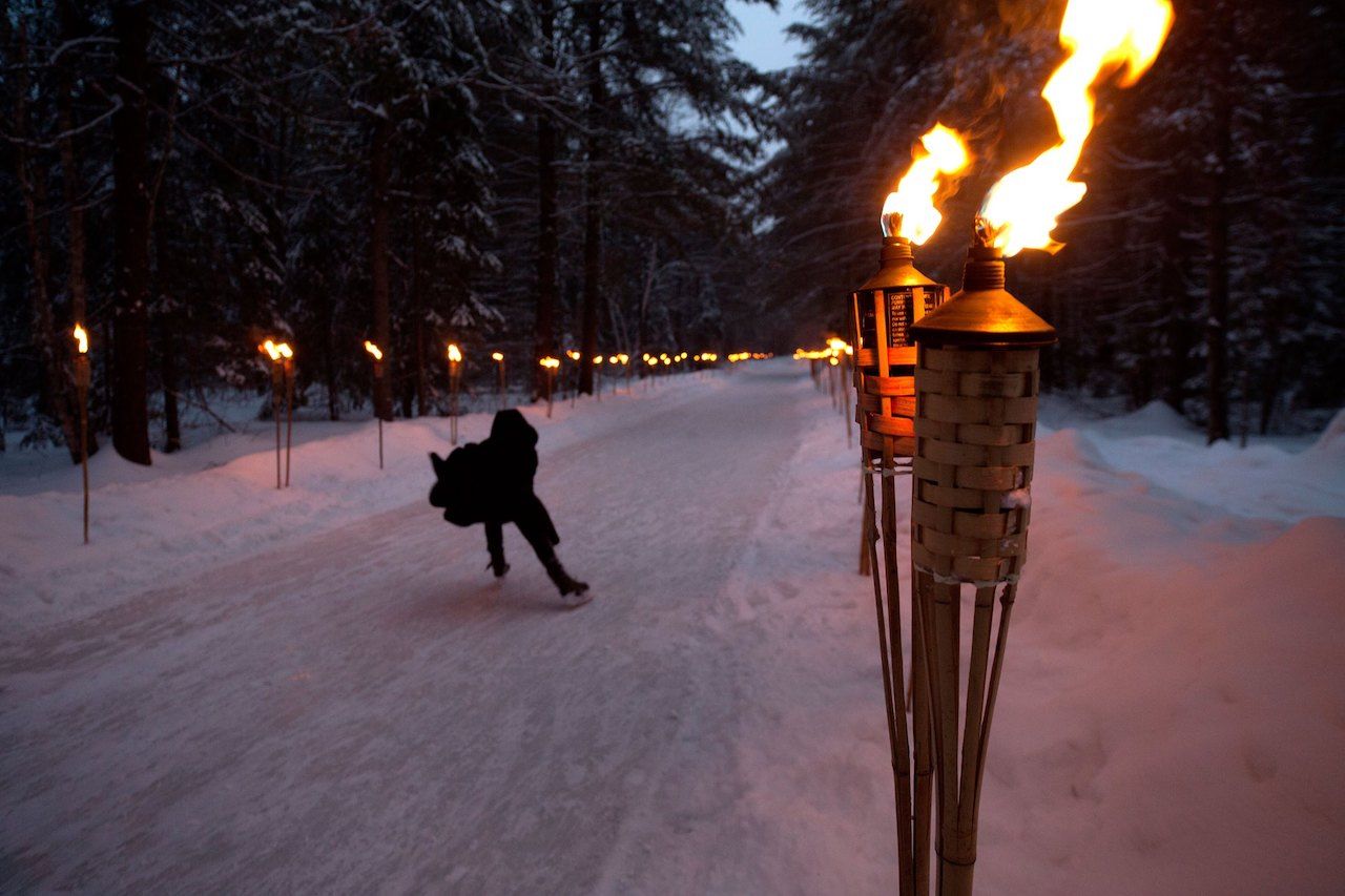 This Ontario Park Has A Skating Trail Lined With Tiki Torches For