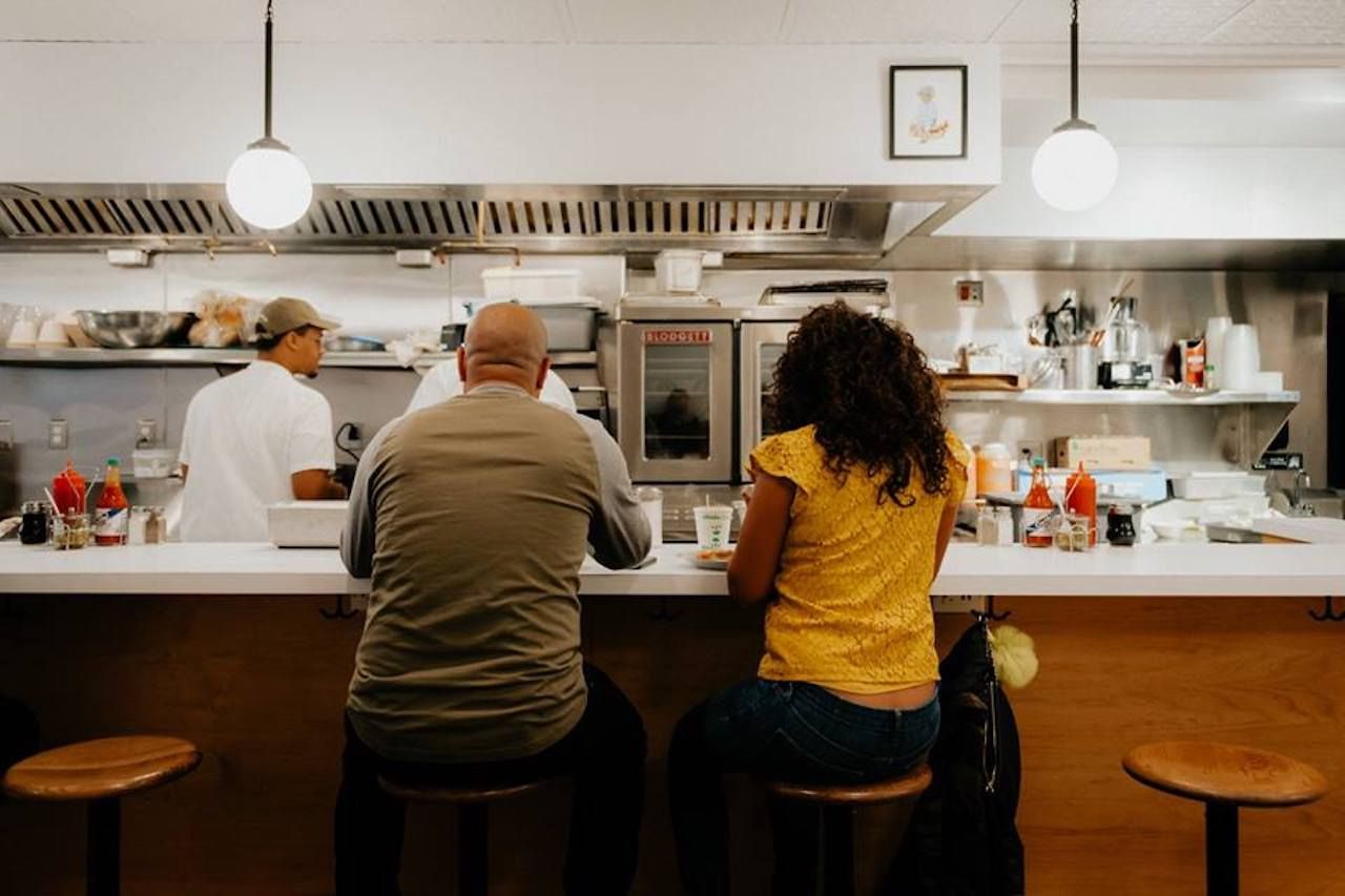Middle Child restaurant in Philadelphia, two people eating at the counter