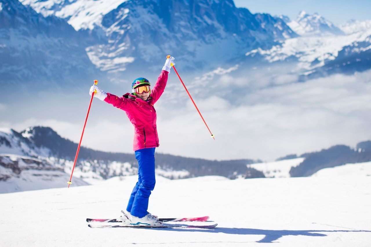 Woman skiing in the Swiss Alps, Switzerland