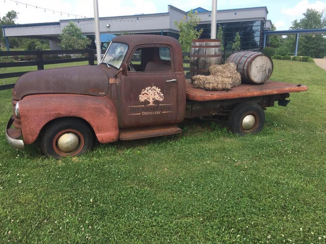 Old truck with bourbon barrels outside Kentucky's Boundary Oak Distillery, LLC