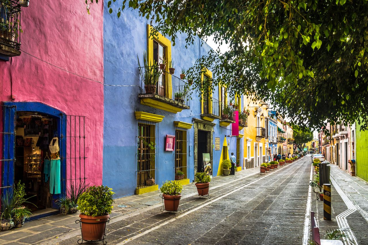 Colorful buildings lining a street in Puebla, Mexico