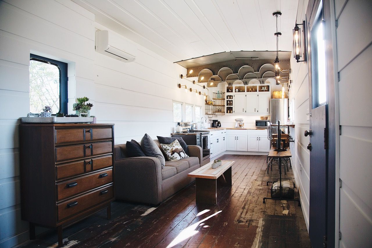 Elegant, modern interior of a train car turned Airbnb