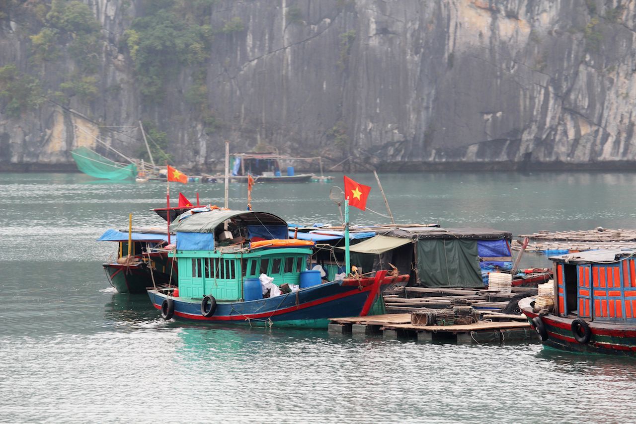 Local fisherman's boats at Cat Ba Island in Ha Long Bay, Vietnam