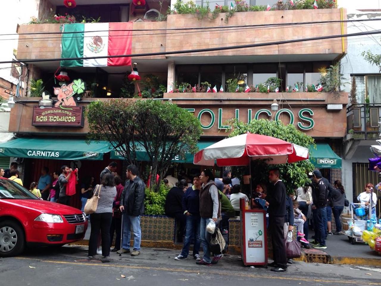 People standing outside Los Tolucos in Mexico City