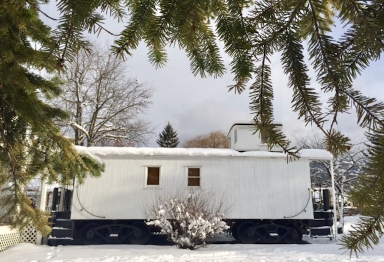 Train converted into accommodation covered in snow