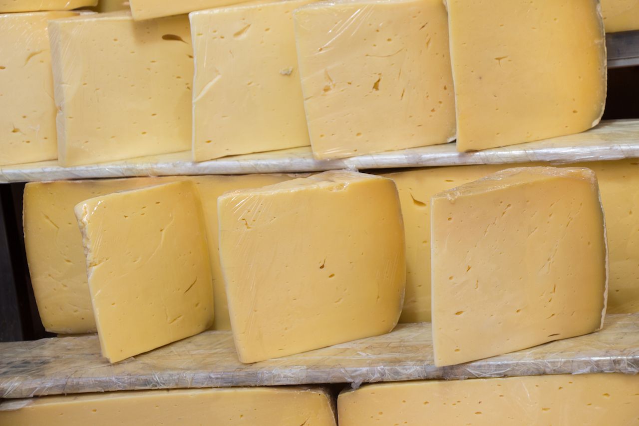 cuts of kashkaval or kasseri cheese for sale on the shelf