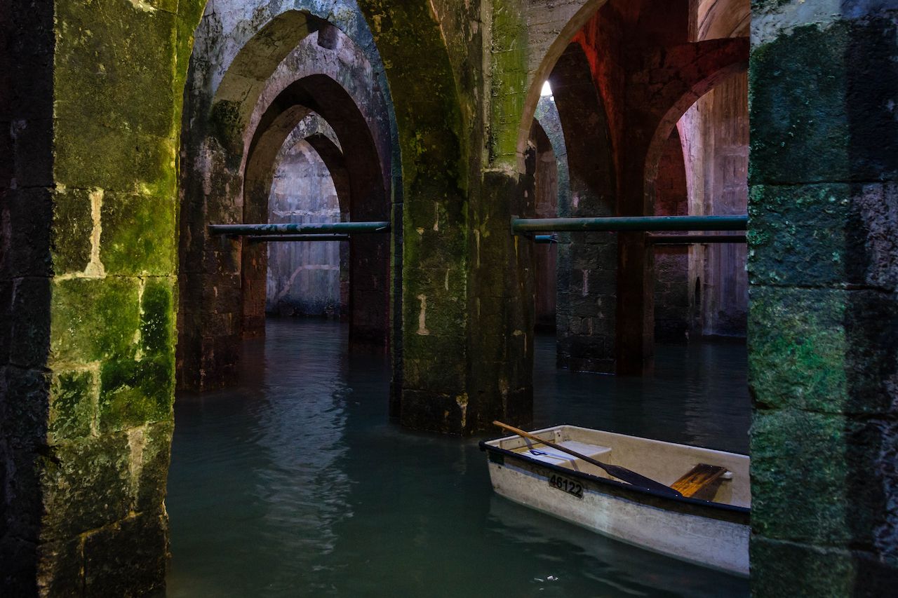 Exploring the 1,200 year old cisterns of Ramla in a row boat