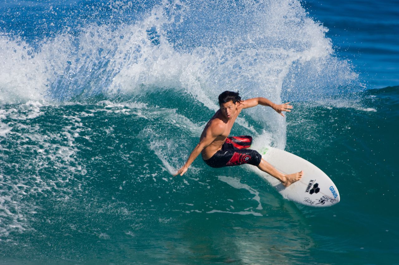 Man surfing a wave in Hawaii