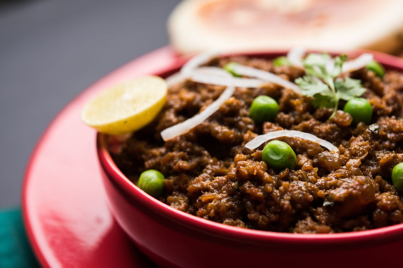 Mutton curry from India with peas and onions