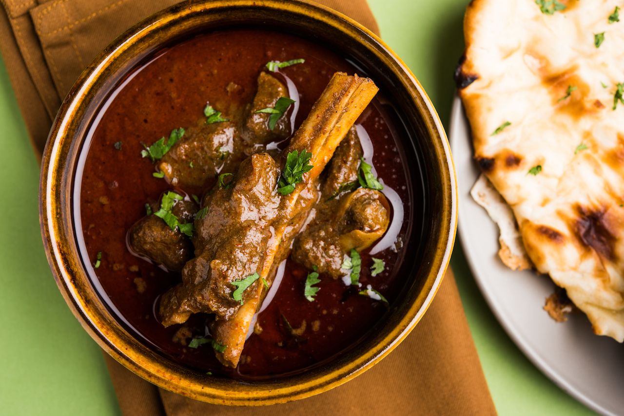 Mutton masala Indian curry served with flatbread