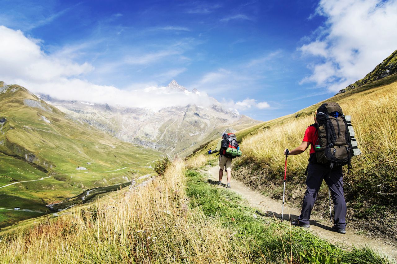 People hiking Tour du Mont Blanc, Switzerland