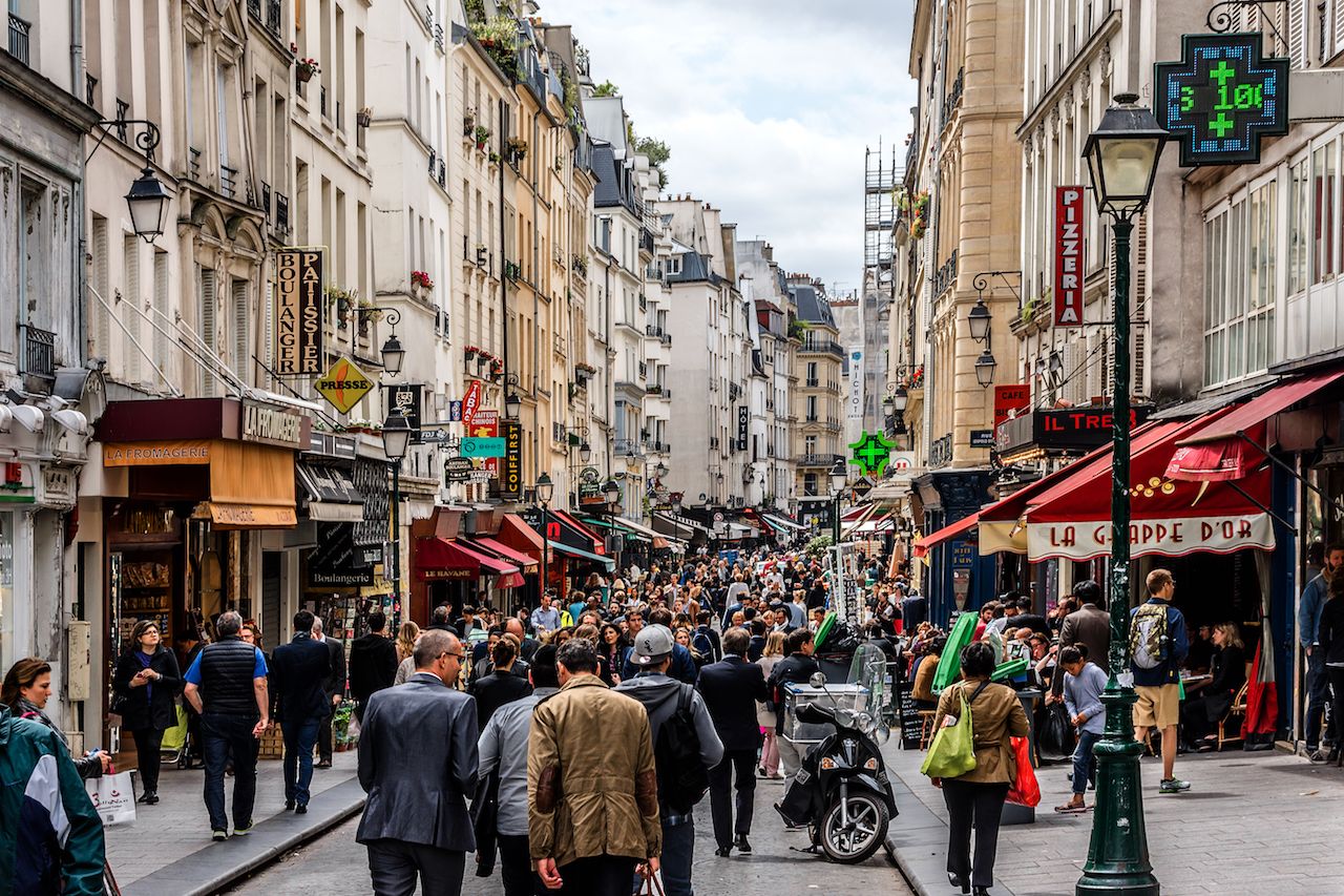 People on a busy French shopping street