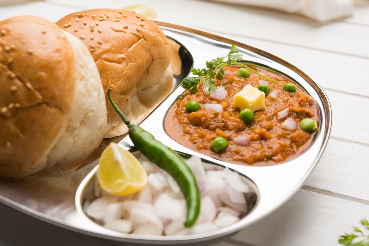 Vegetable curry from India with soft bread rolls