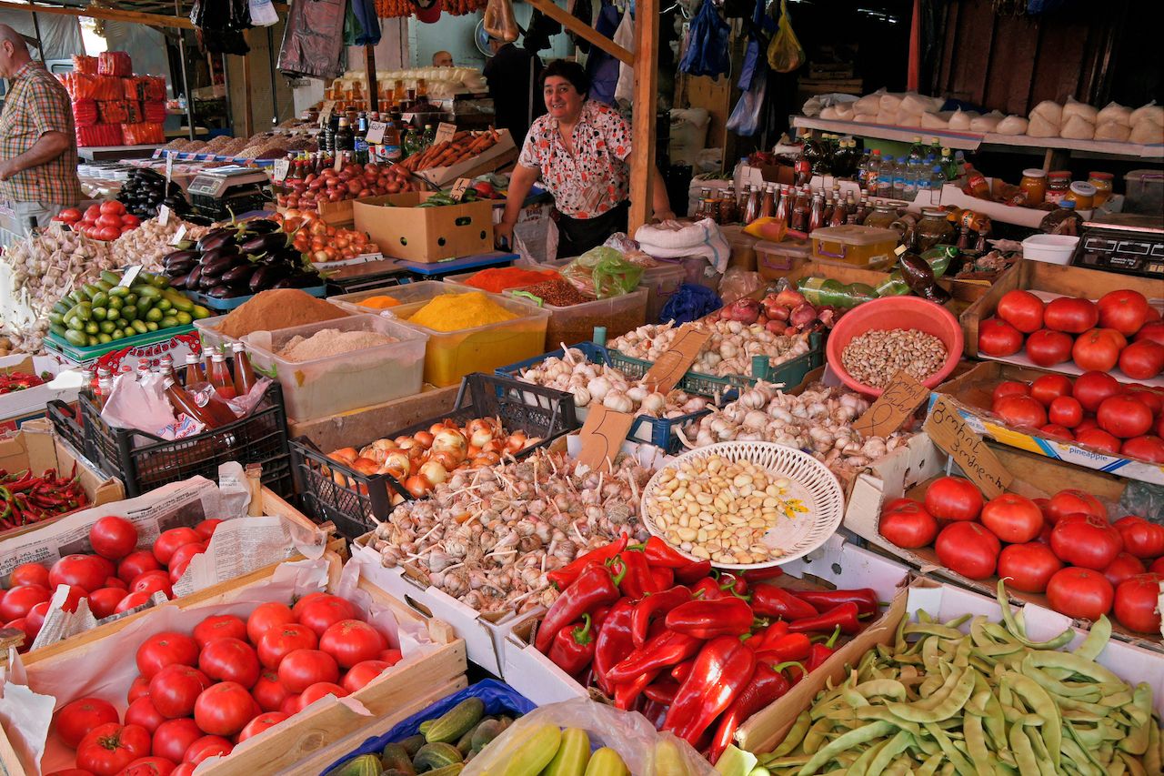 Vendors sell a wide variety of fresh produce, spices, and other products at a bazaar in Georgia