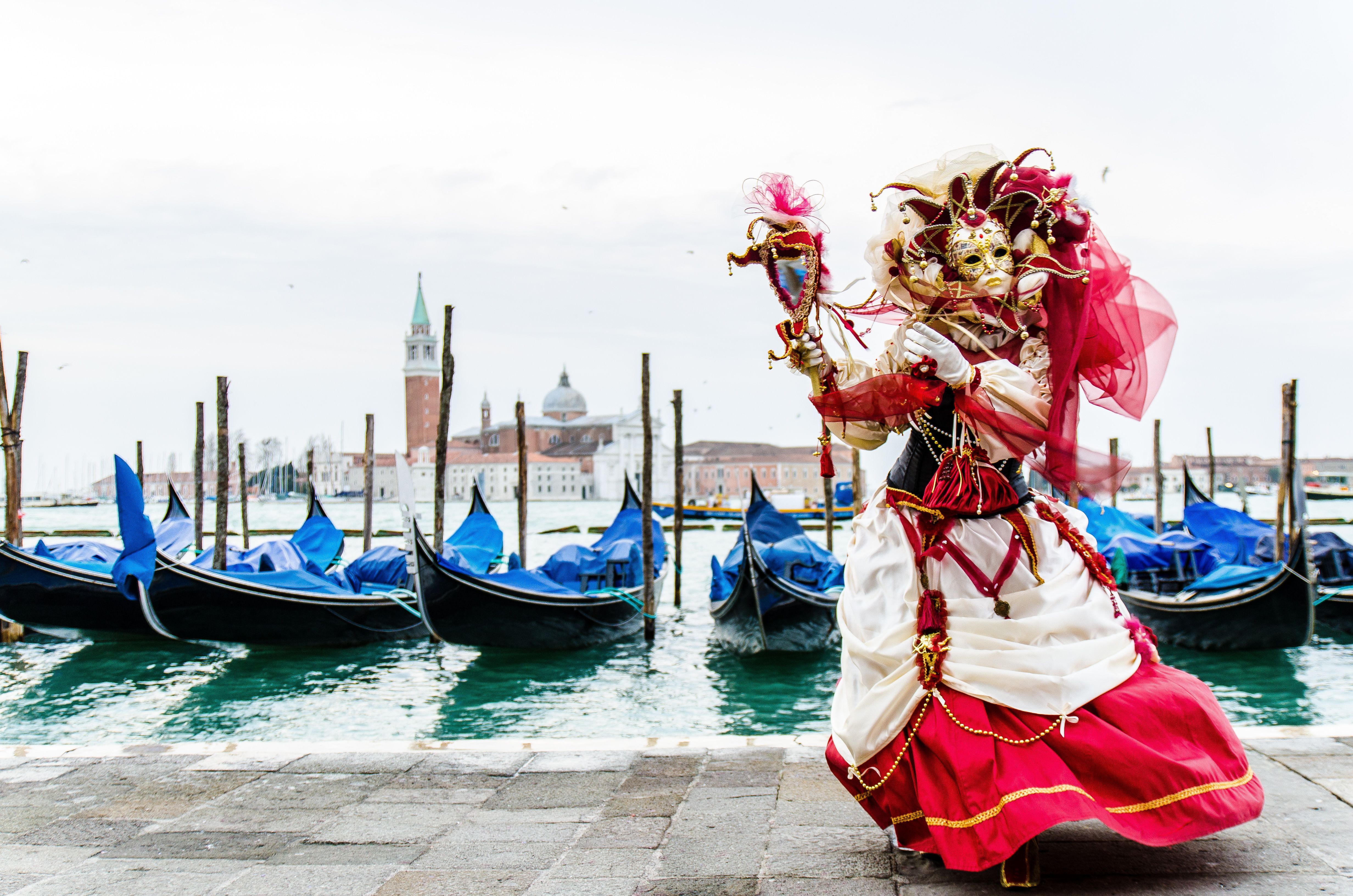 Beautiful mask with gondolas during the carnival in Venice