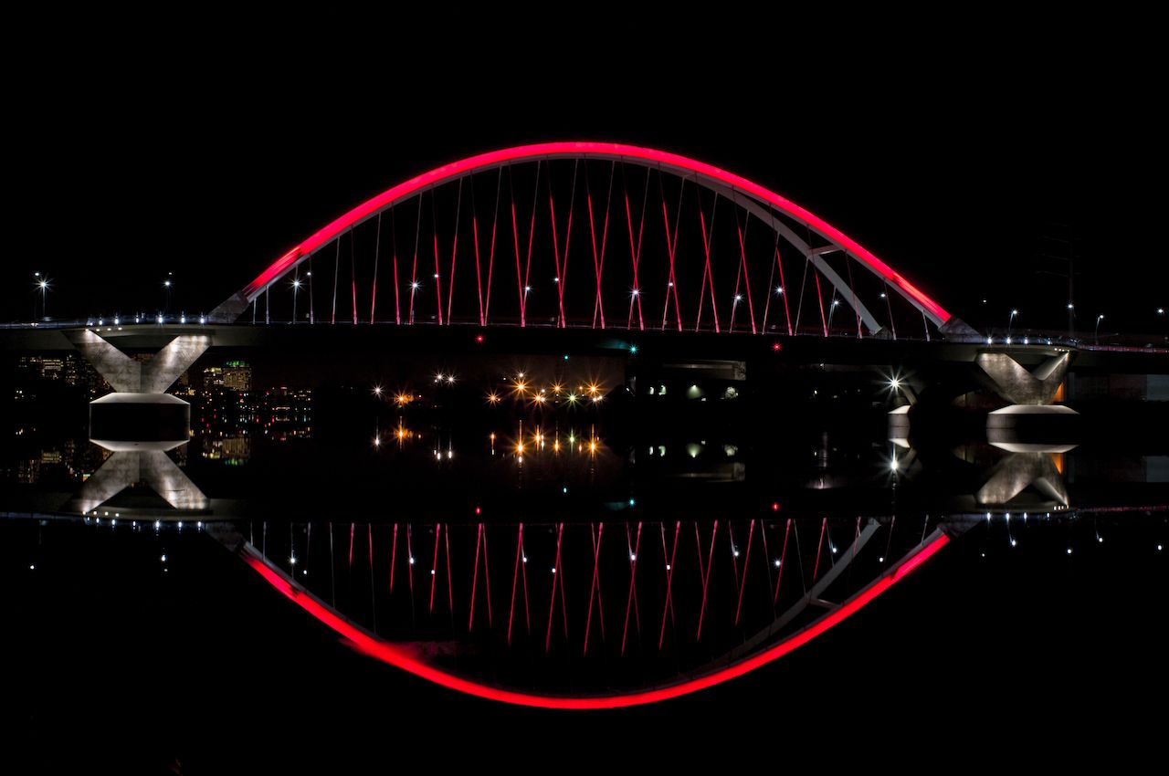 Bridge in Minneapolis lit red at night