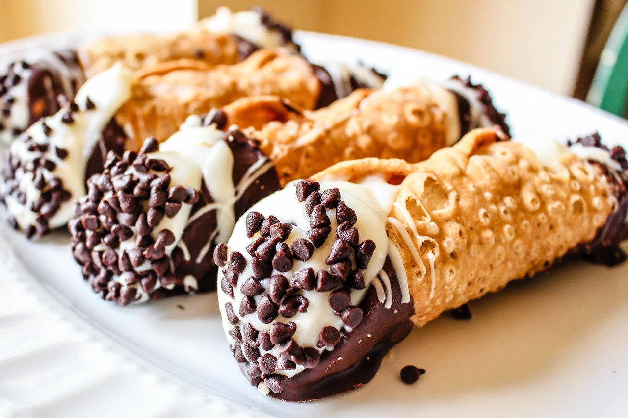 A scrumptious platter of chocolate dipped Cannoli with chocolate chips
