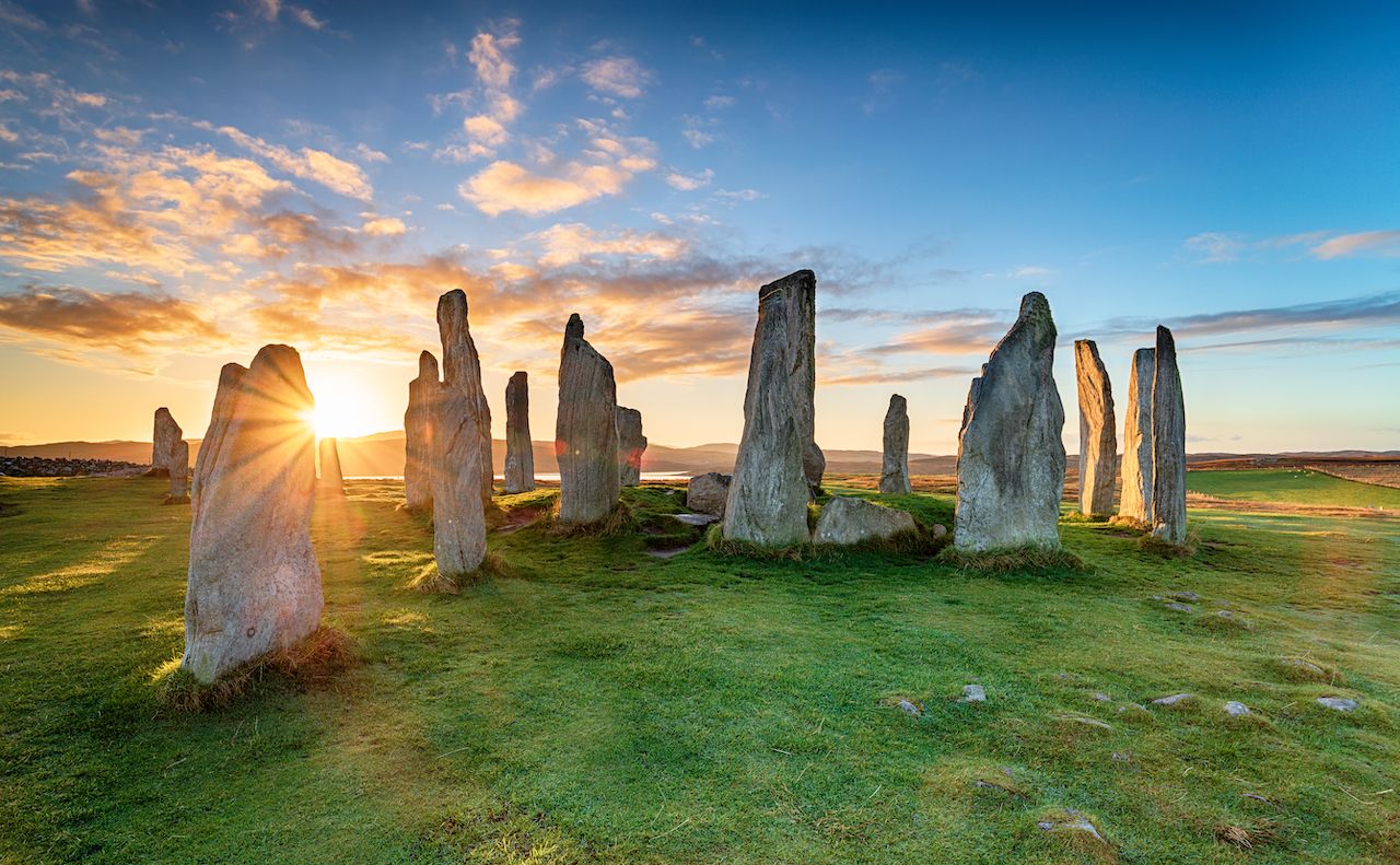 Stunning sunset over the Callanish stone circle on the Isle of Lwais in the Outer Hebrides of Scotland