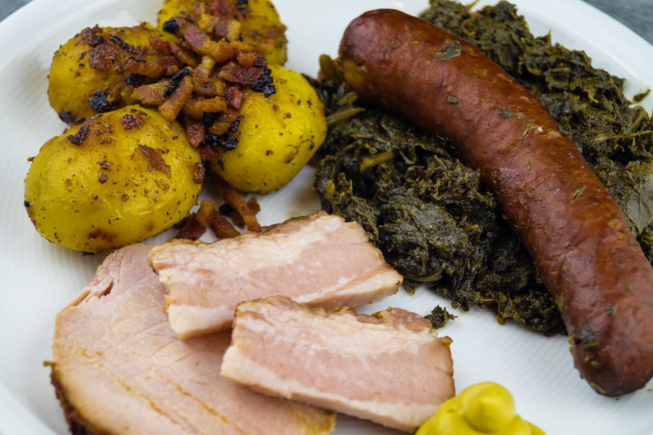 Traditional Northern German Food Curly Kale with bacon pork and sausages