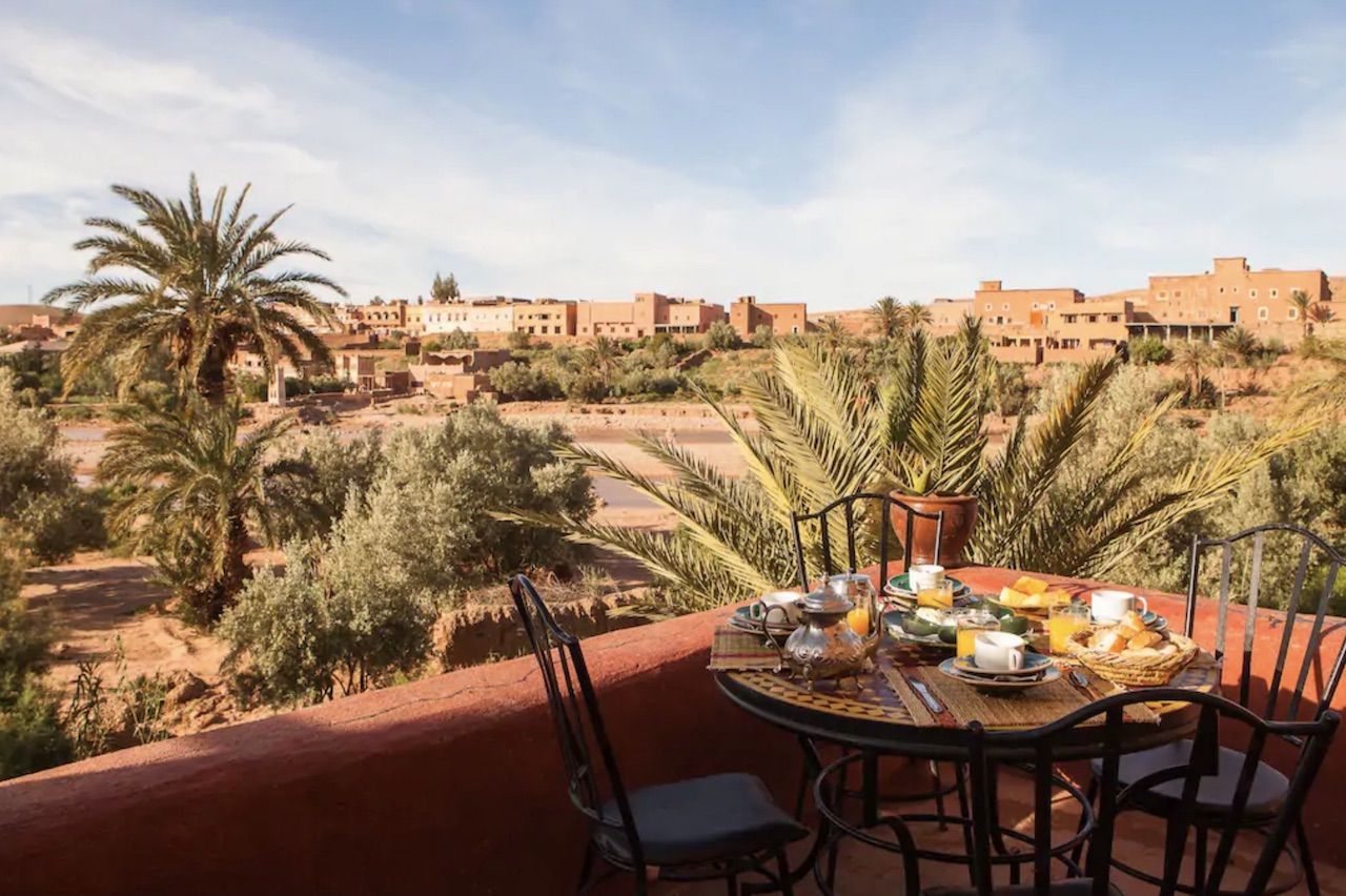 Breakfast table set outside with views over Morocco