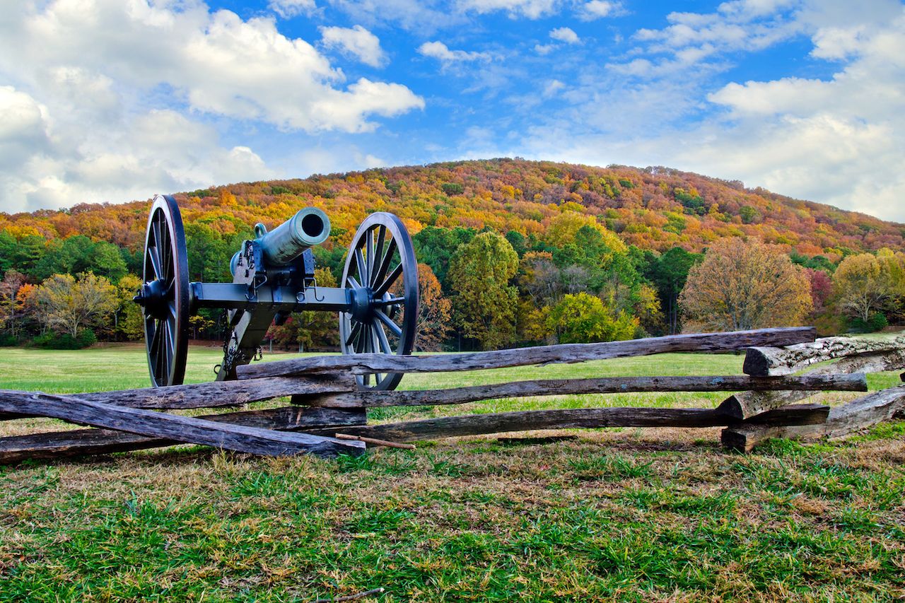 Civil War era cannon overlooks Kennesaw Mountain National Battlefield Park during fall