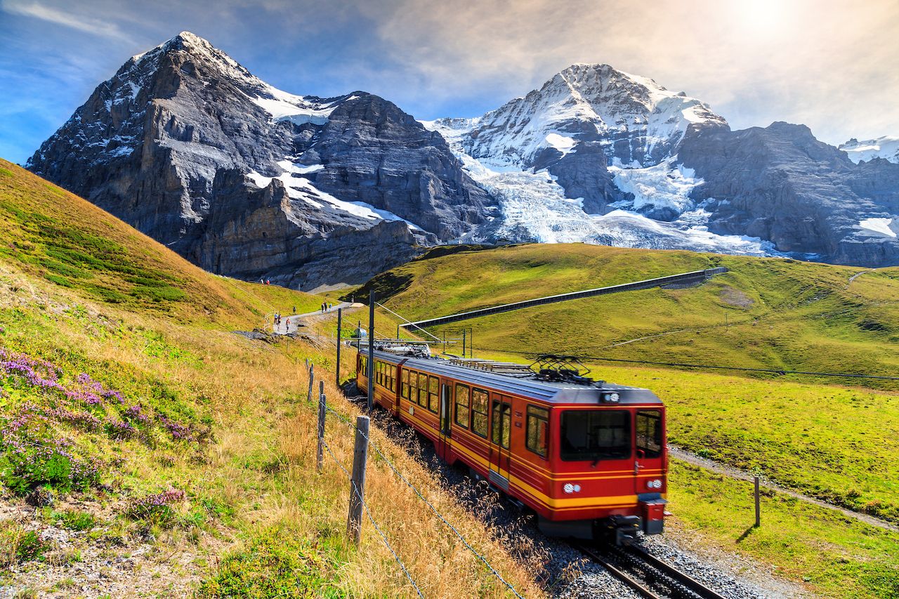 Famous electric red tourist train coming down from the Jungfraujoch station