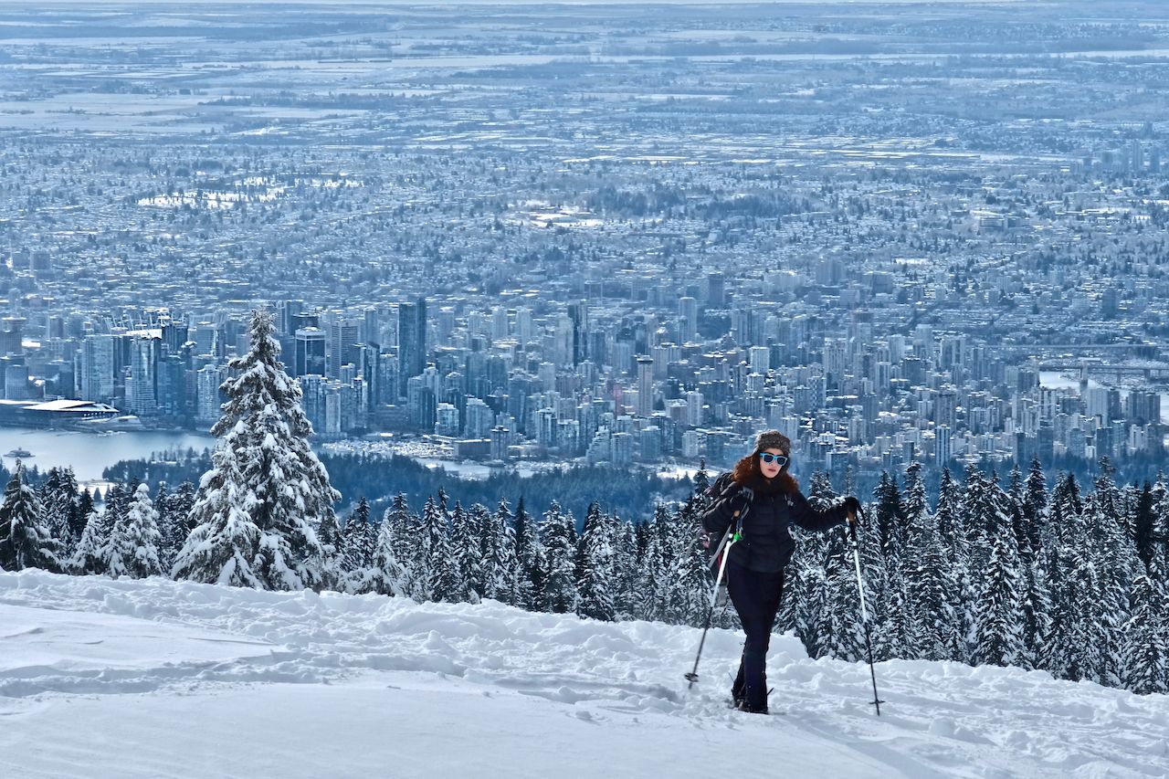 Woman hiking snowshoeing near North Vancouver on Cypress Mountain