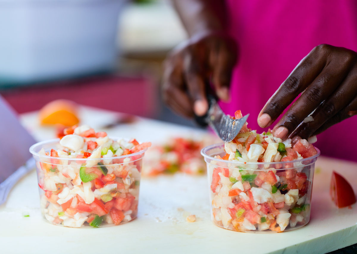 Traditional Bahamian Food And Dishes From The Bahamas   Person Making Traditional Conch Salad 1200x853 