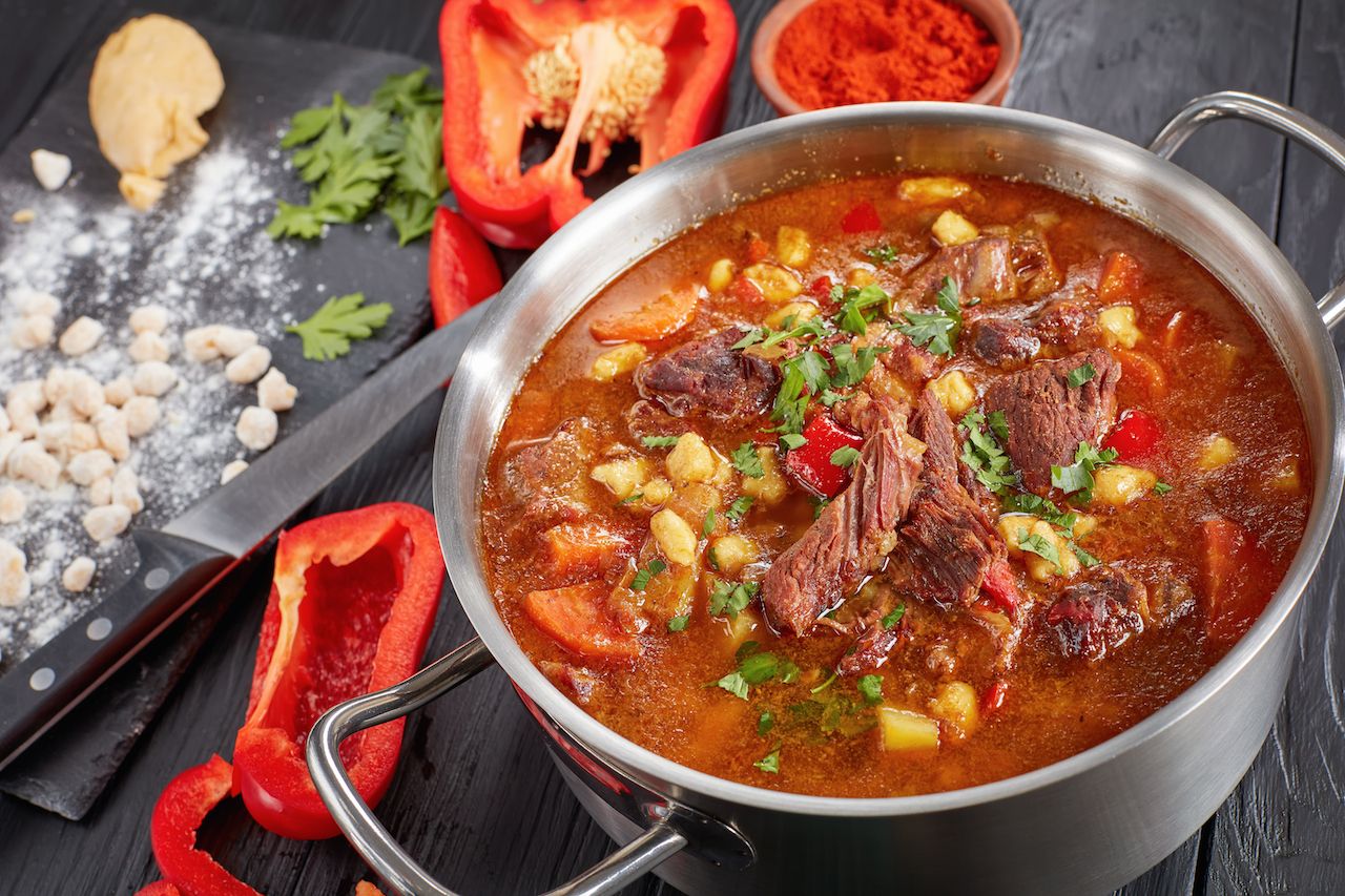 hungarian goulash or bograch soup with paprika, small egg pasta, vegetables and spices in a pot