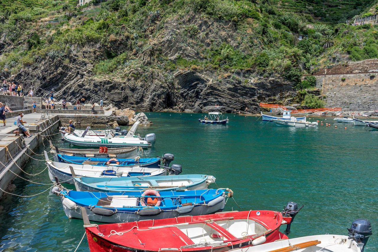 Boats docked near the shore at Vernazza, Cinque Terre, Italy