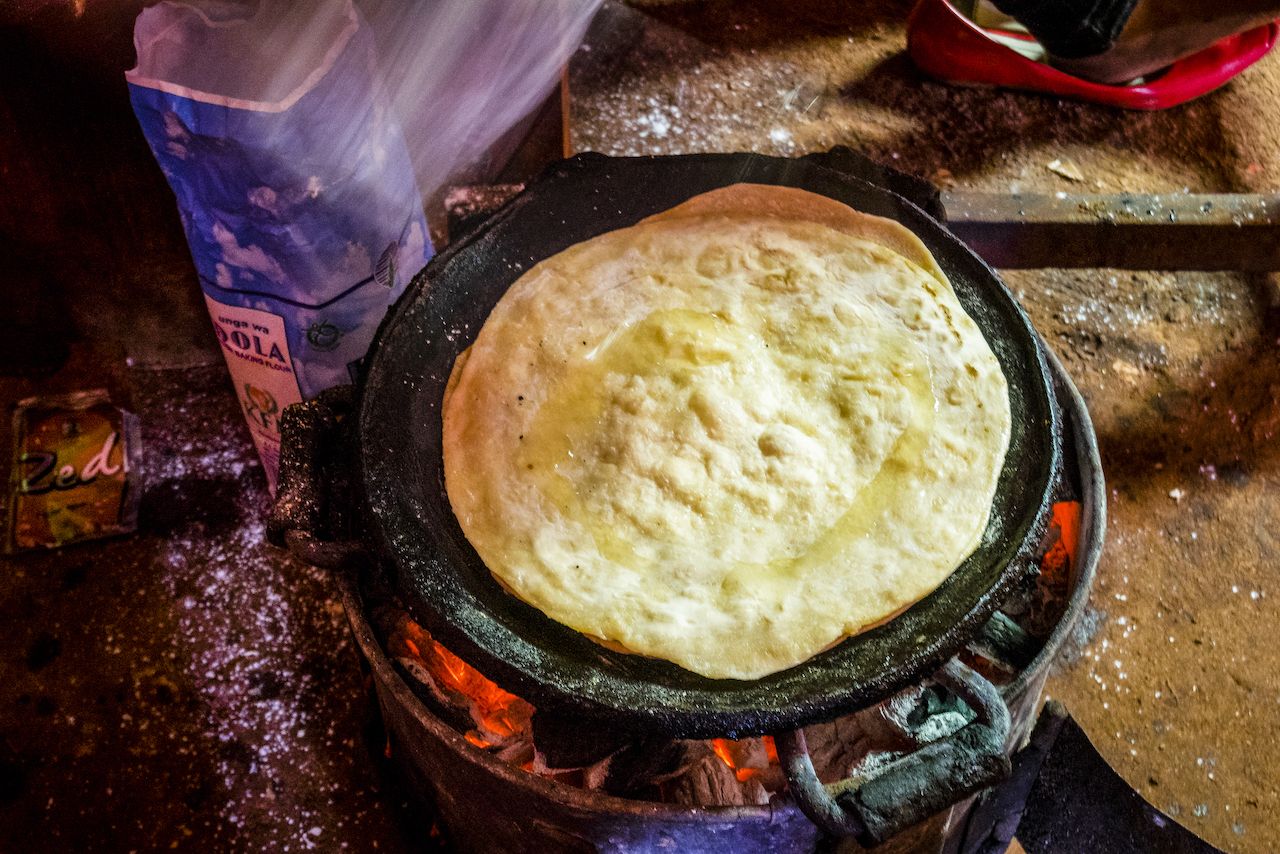 Preparing chapati in simple restaurant in Kenya, East Africa