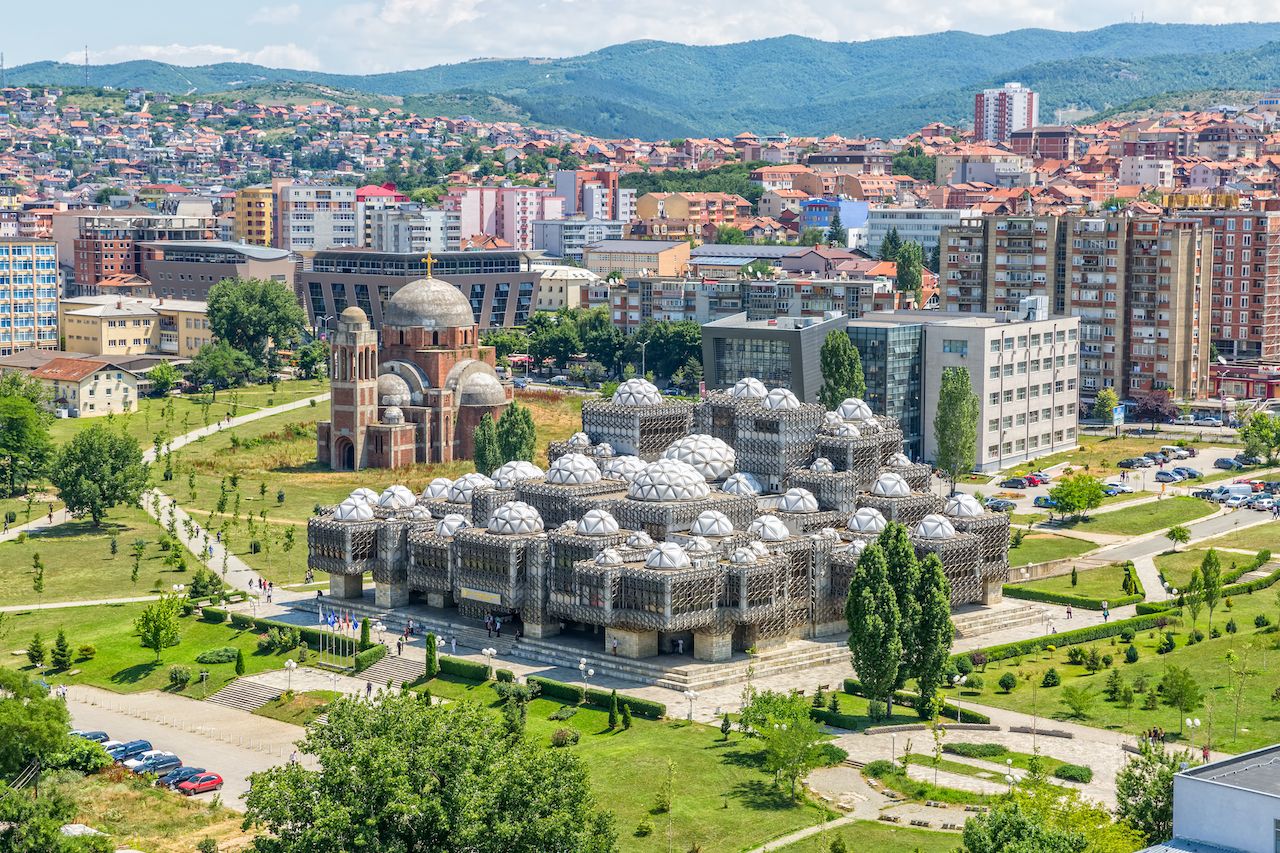 Aerial view of capital city with some old buildings like National Public Library and Christ the Saviour Cathedral, Kosovo