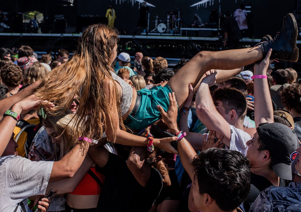 A fan crowd surfs, Lollapalooza