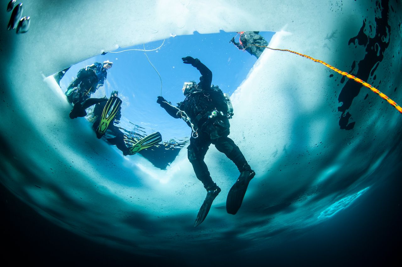 Winter ice diving underwater