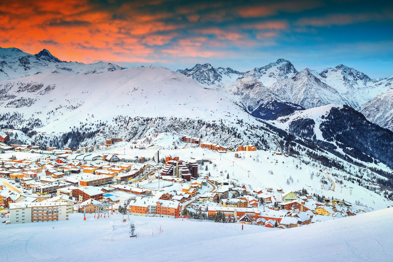 all-inclusive ski resort in the alps at sunset