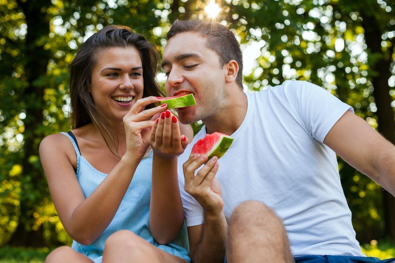 Couple eating watermelon