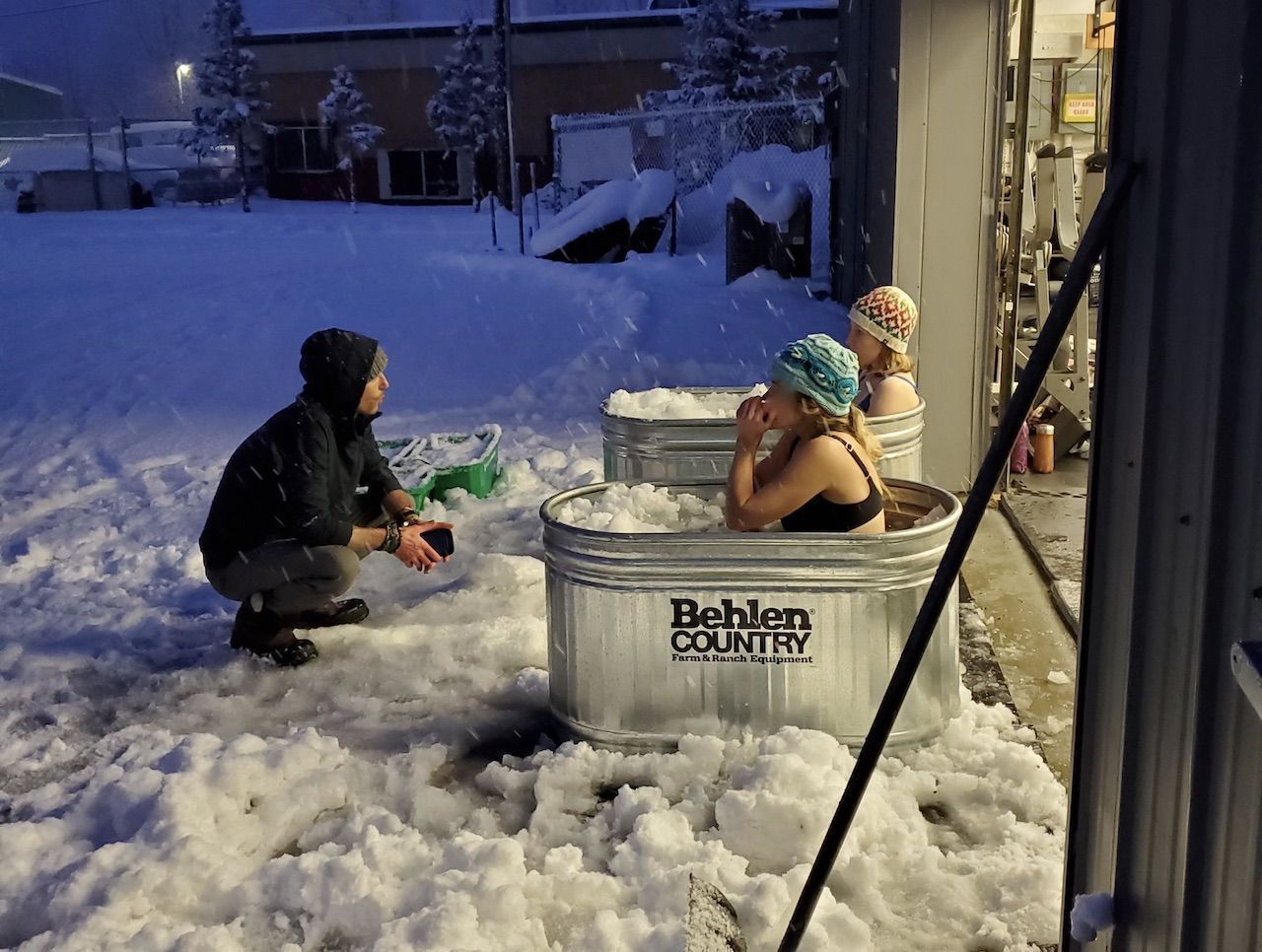people doing wim hof breathing method in cold baths